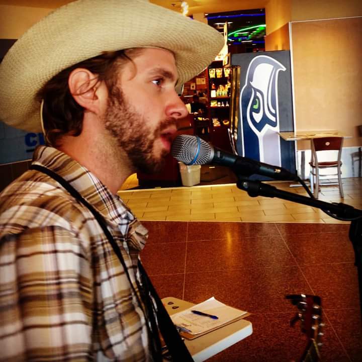 JustMeJasperT's tweet photo. Playing at #SeaTac airport! Like my hat? Photo by @RamonaLisaG. #Seattle #PNW #JasperT #TryGuitar #AirportLife http://t.co/OZGBEadlog