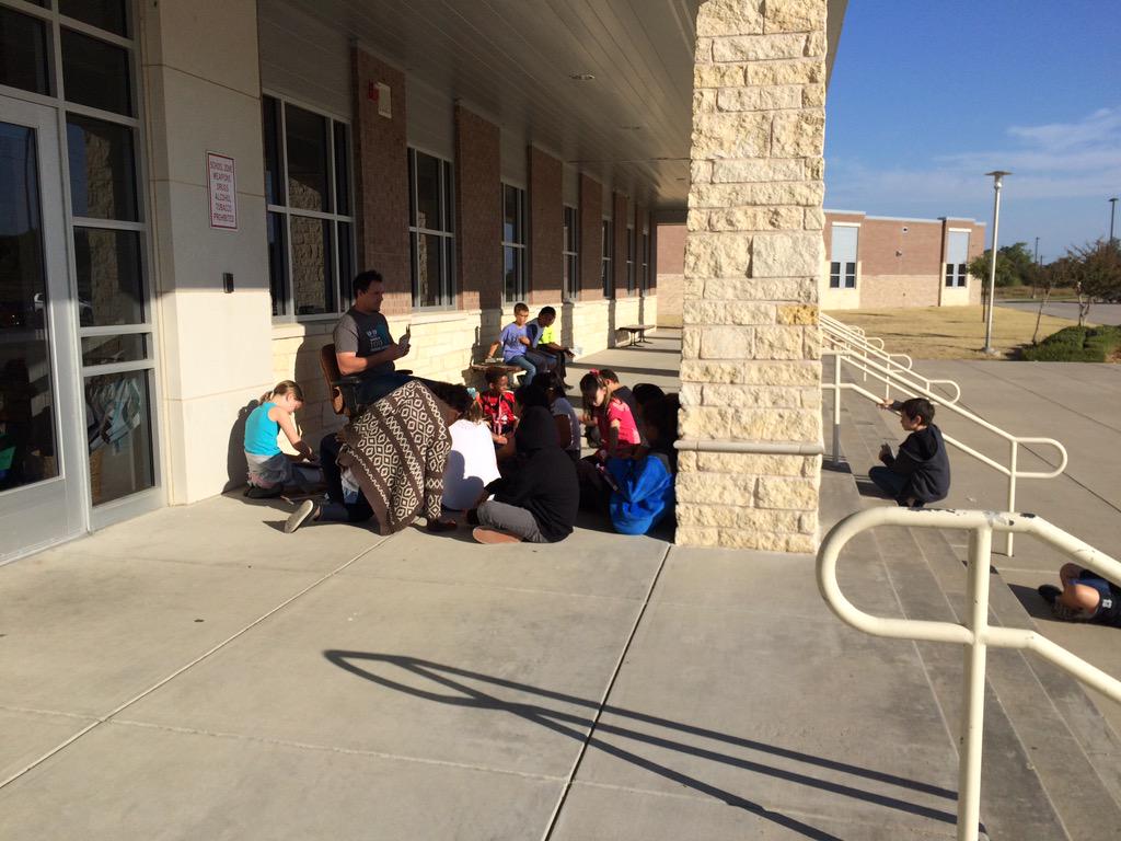 Mr. Kane's 5th graders enjoying reading and writing in this beautiful weather!