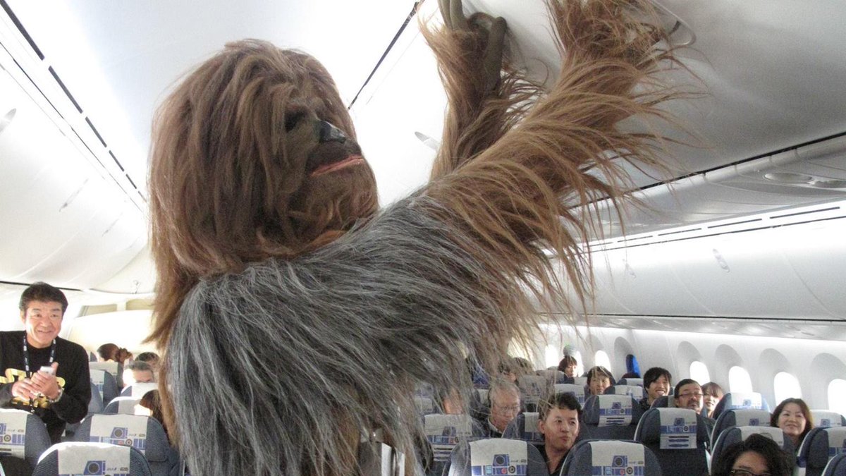 mashable's tweet image. #StarWars fans went all out for R2D2-themed plane's first passenger flight on.mash.to/1PpKysg