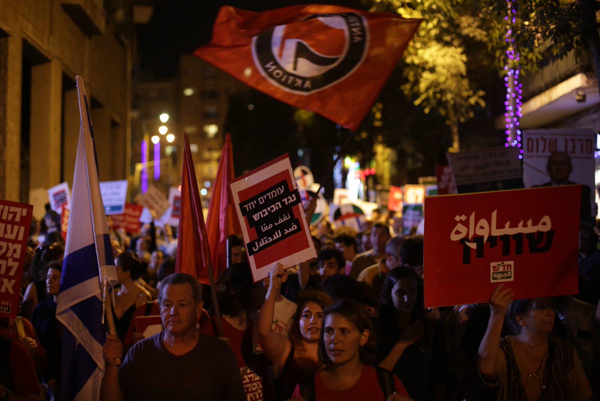 haaretzcom's tweet image. Jews and Arabs rally for coexistence in #Jerusalem: 'we will not surrender to despair' htz.li/3Ey