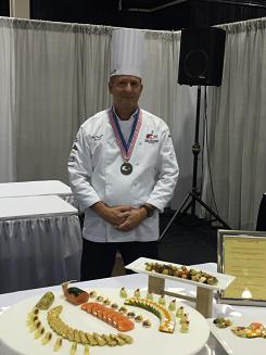 WMUDining's tweet image. Chef Tom Giles of WMU Dining Services receives a silver medal at the MRA show in Novi, MI! #WMU
