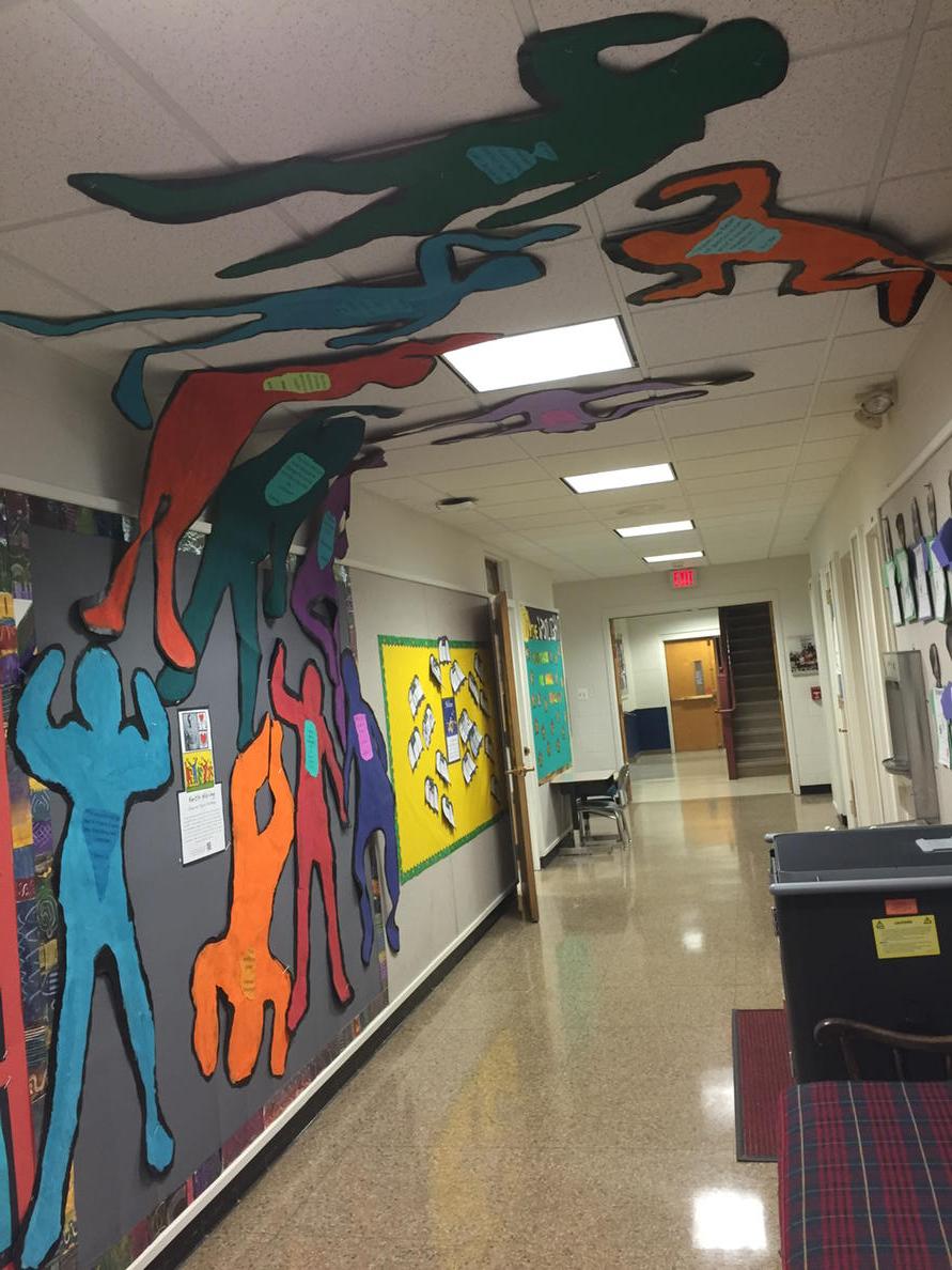 3rd grade Keith Haring figures dance through the hallways at Germantown Academy's Lower School @GA1759 #haringart