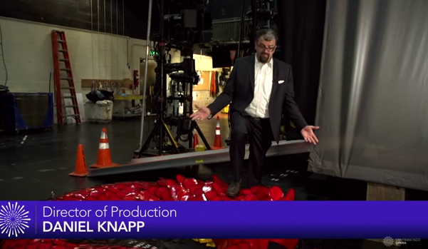 SFOpera's tweet photo. Behind the scenes with parts of a dragon: @knappdaniel on #MagicFluteSF video https://t.co/mL6HWzaa5T #opera https://t.co/0VOe122Nee