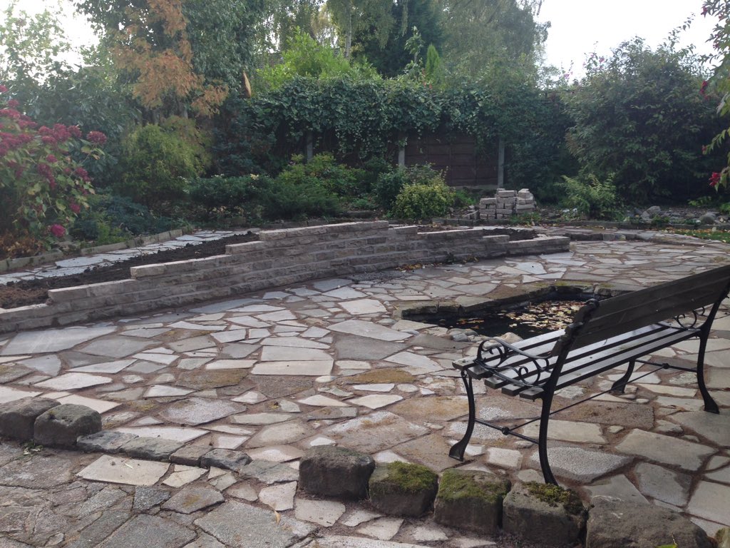 Wasted overgrown area in the garden transformed into a crazy paved patio, staggered wall and a pond! 5 days work #HL