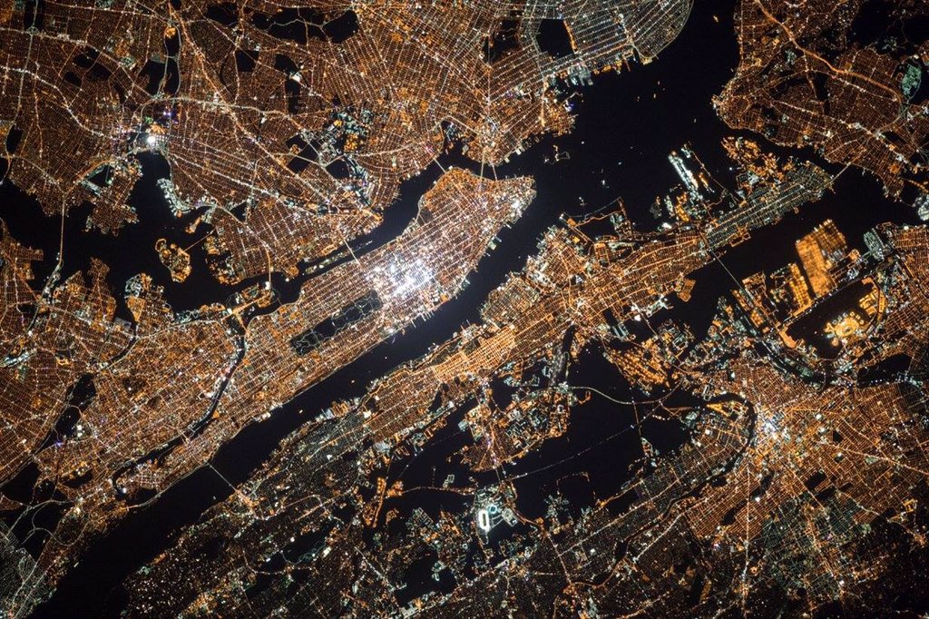 PS199SC's tweet photo. 15 years of human #astronauts on board @ISS_Research. A photo of #NYC taken from the ISS on October 18,2015. #STEM https://t.co/BsrifTZ66S