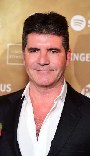 GlobalsNewsroom's tweet photo. Simon Cowell's been presented with an #MITAward for his contribution to music, entertainment and charitable causes. https://t.co/WqZO0wCEFf