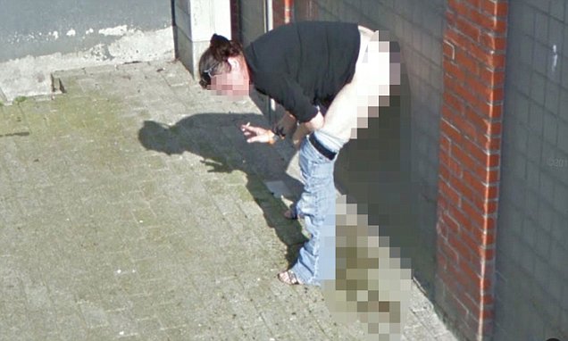 DailyMail's tweet photo. Dutch woman caught urinating against a wall while smoking on Google's Street View camera 😧 https://t.co/opFtIO7XbE https://t.co/fK9bQvE8r3