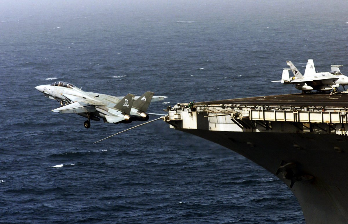 An F-14D assigned to VF-103 launches from the flight deck of the #USSGeorgeWashington #TomcatTuesday #AircraftPhoto