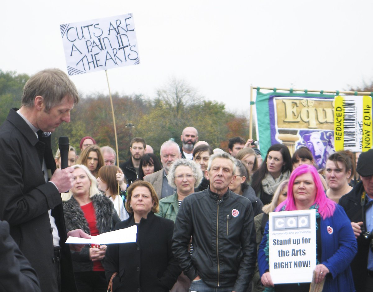 sourcephoto's tweet photo. Glenn Patterson addresses politicians and protestors at Stormont rally today @ArtsMatterNI against arts cuts https://t.co/Ku7FAd84MC