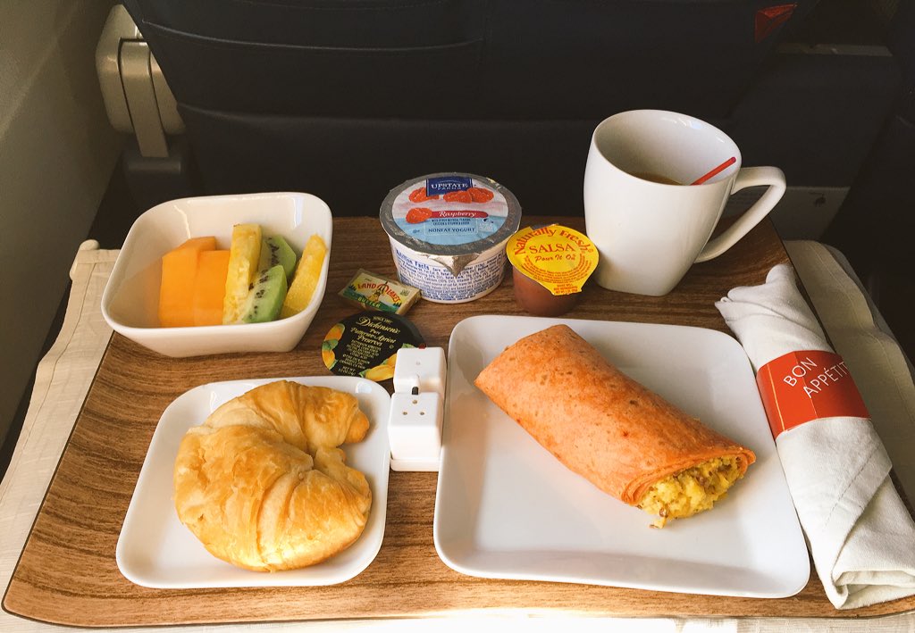 DJNoah80's tweet photo. Drink #2, @Starbucks coffee, and the @Delta breakfast Burrito Olé! TCSNYCMarathon #VictoryFlight https://t.co/8ZFIqIL6Wu