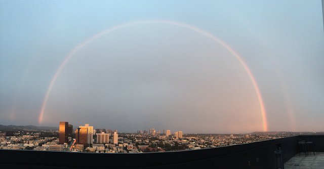 LAist's tweet photo. Photos: Gorgeous Unbroken Rainbow Soars Over Los Angeles https://t.co/RIV9maQAhN https://t.co/Bsa6Jumsjm