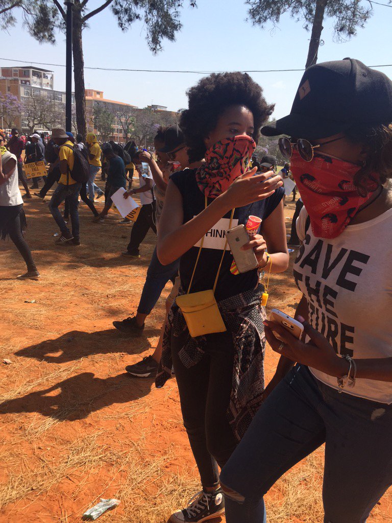 MapsMaponyane's tweet photo. Teargas has all the protesters, choking and dispersing in all sorts of directions to get as far away. #FeesMustFall https://t.co/NomtbNqHEd