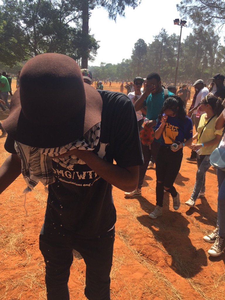 MapsMaponyane's tweet photo. Teargas has all the protesters, choking and dispersing in all sorts of directions to get as far away. #FeesMustFall https://t.co/NomtbNqHEd