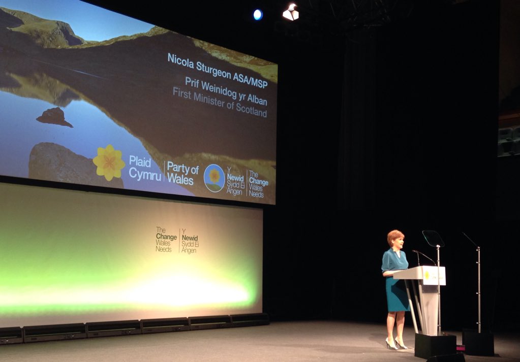 theSNP's tweet photo. .@NicolaSturgeon addressing #plaid15 in Aberystwyth and begins by thanking @Plaid_Cymru members for their support https://t.co/AmJHRaH9U8