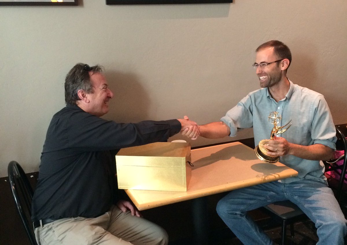 EarthlightDoc's tweet image. Earthlight producer and executive producer shake hands over the Emmy! @uacals @ArizonaCEAC @azcoopext