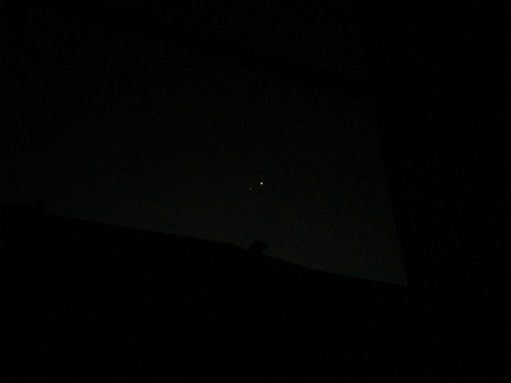 AllanManangan's tweet photo. The two bright objects are to the east and above the adjacent two-story roof line. It is after dawn. https://t.co/oUNXk38BFK