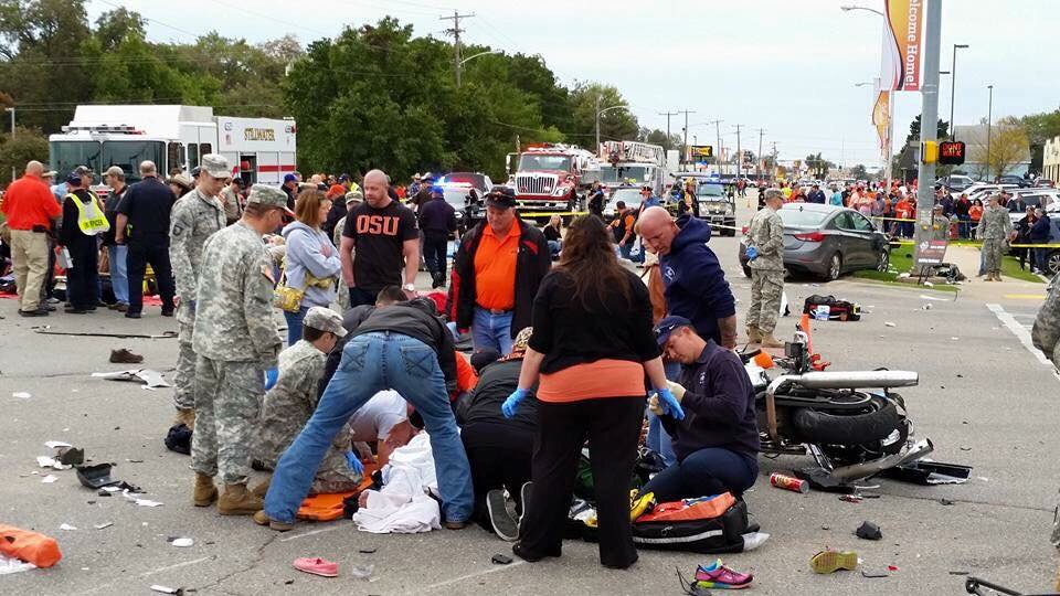 LacieLowry's tweet photo. UPDATE: 3 dead, 10 critical, 27 airlifted to hospitals after car plows into OSU homecoming crowd. Driver in custody. https://t.co/6ghm9zLqNv