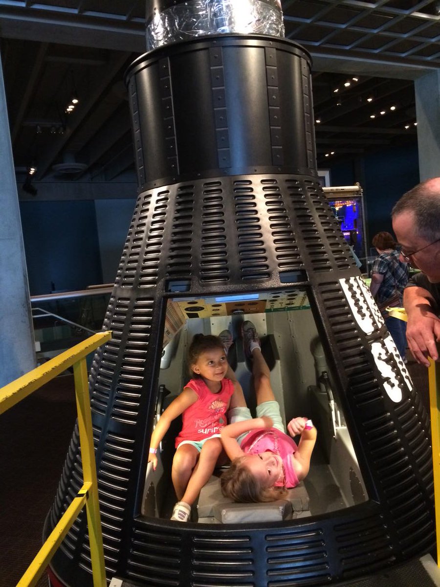 SusanKohler99's tweet photo. Future astronauts try out the capsule at NASA GRC visitor center. https://t.co/cKxpJCJMNw