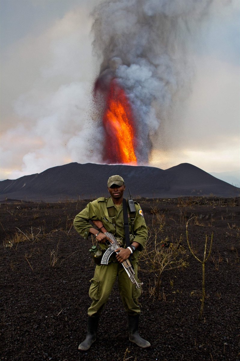 A park ranger standing guard as Mount Nyamulagira erupts in eastern Congo
