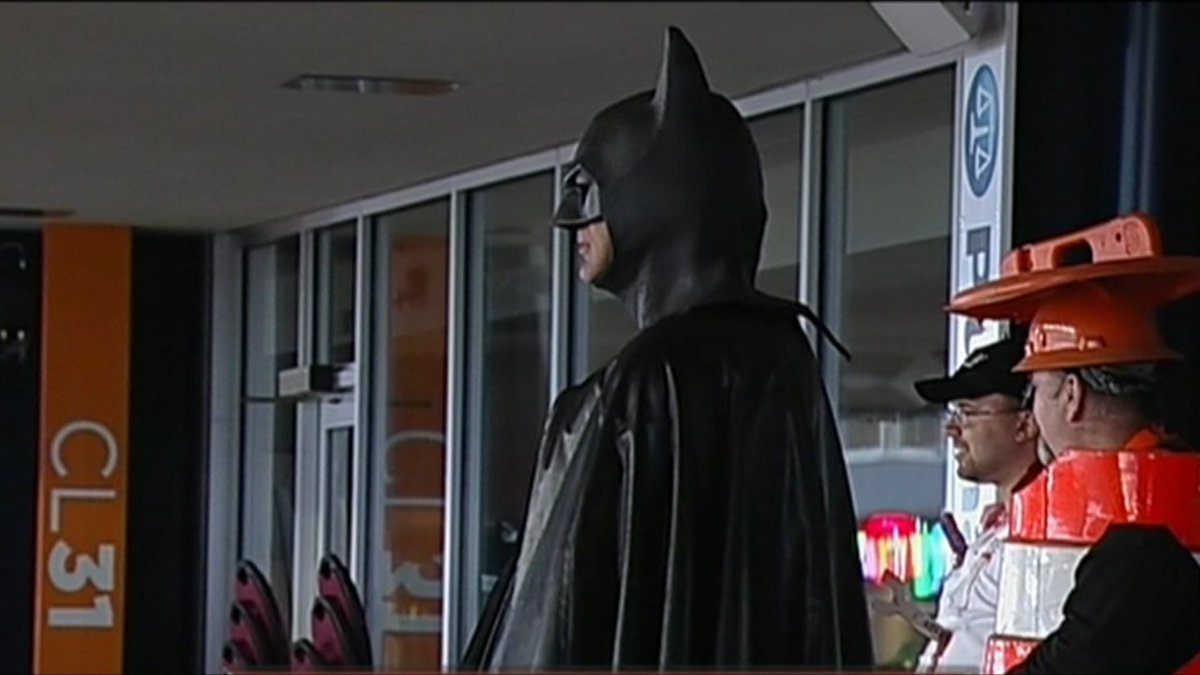 SportsCenter's tweet photo. The Dark Knight himself watches over Toledo vs UMass game. https://t.co/dmYGLydUsJ