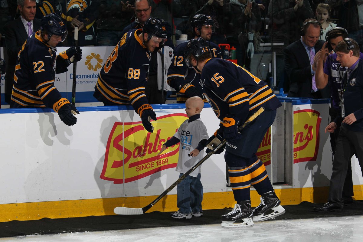 BuffaloSabres's tweet photo. Step by step: @Jack_Eichel11 escorted Matthew Eggers (@mdeggs100) during the pregame ceremony. #HockeyFightsCancer https://t.co/oFdEUT5ZBj