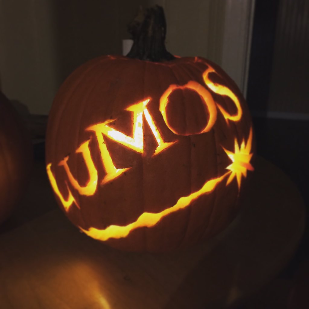 Pumpkin with Lumos carved into it