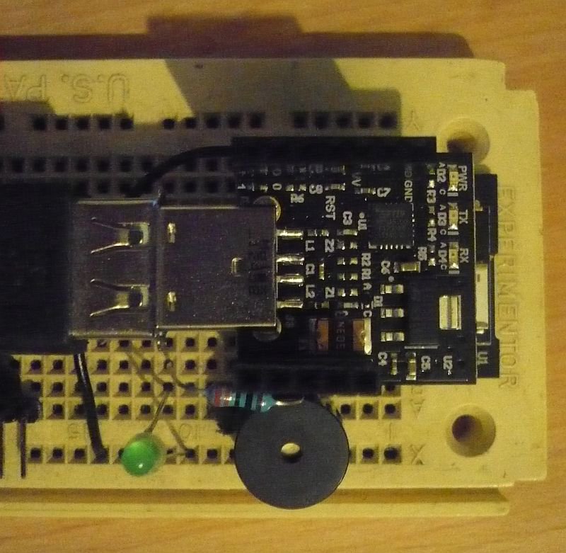 Monsonite's tweet image. #RFduino on a breadboard with programmer. I am now running #SIMPL on RFduino. BTW- I bought this breadboard in 1980!