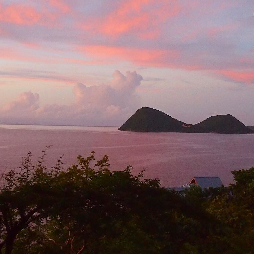 UncommonCarib's tweet photo. Sunset over the Cabrits as enjoyed from Secret Bay. #Dominica #ucdominicawk https://t.co/srJ5z6euJO https://t.co/diZnRgk48X