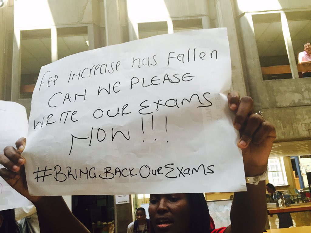 thedailyvox's tweet photo. Placards by students who want to write exams. #SenateMeetingOccupation #FeesMustFall https://t.co/Mksqw3hT5G