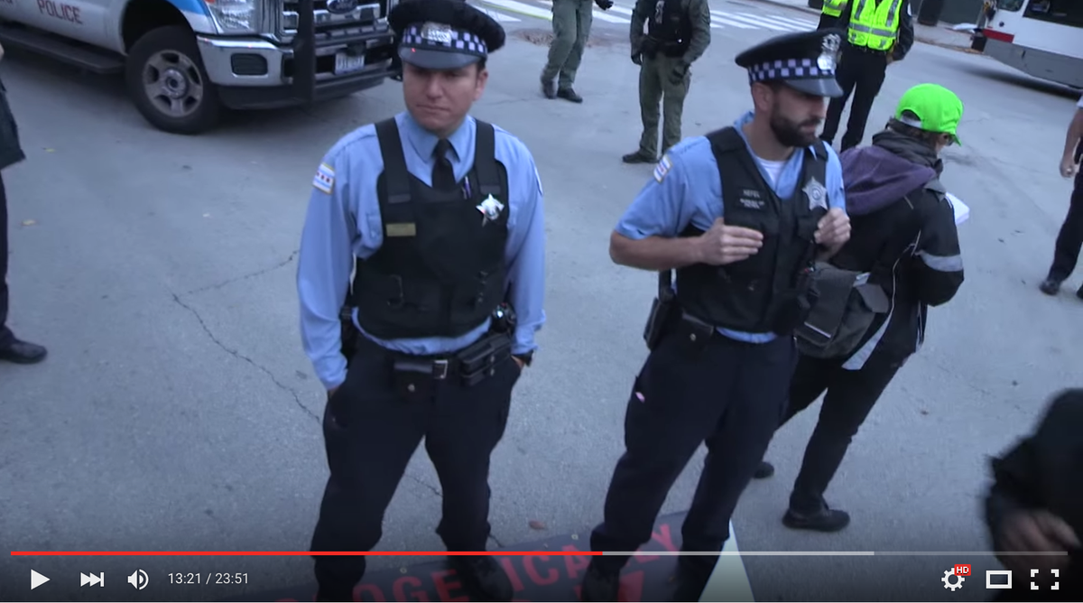 byp100's tweet photo. Cops stood on our "Unapologetically Black" banner as a passive-aggressive display of intimidation. #StopTheCops https://t.co/h1jiGbsNkq