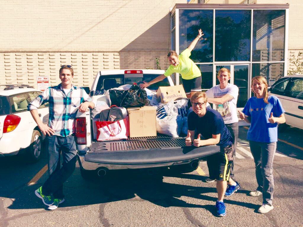 UTRefugee's tweet photo. BYU students lend refugees a helping hand. Picking up donations instead of trick-or-treating! #inspiring #byu https://t.co/wN4ShTB4or