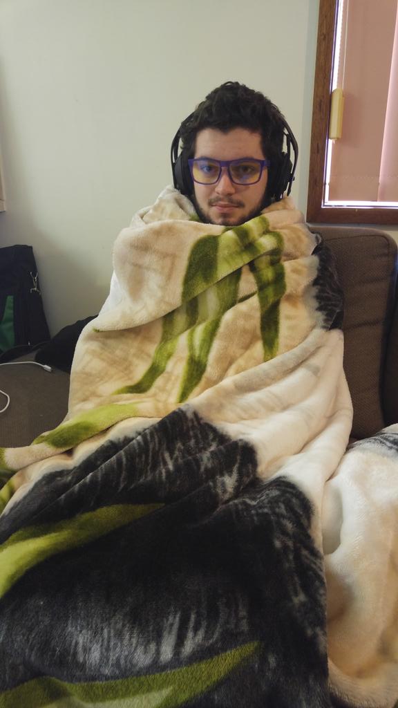 Nickbait's tweet photo. @flariion, rocking equal parts sleep deprivation and mink blanket as he powers through the #Halo5 campaign! https://t.co/y6UO3R56CA