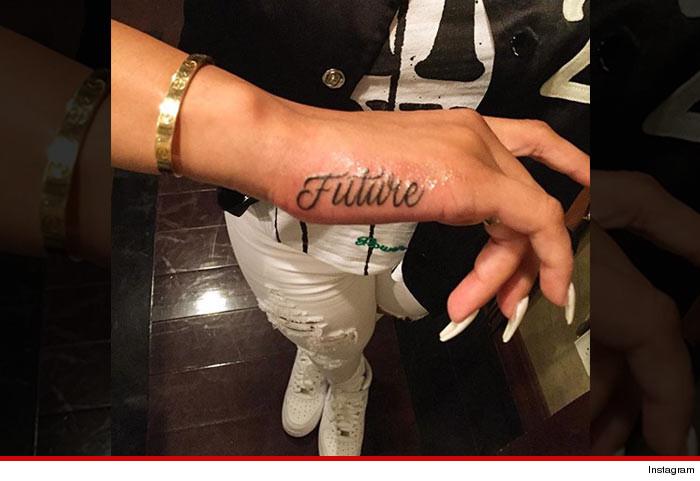 Black Chyna tattoos rap star Future's name on her hand after one month of dating.  Is it too early? Would you ever?