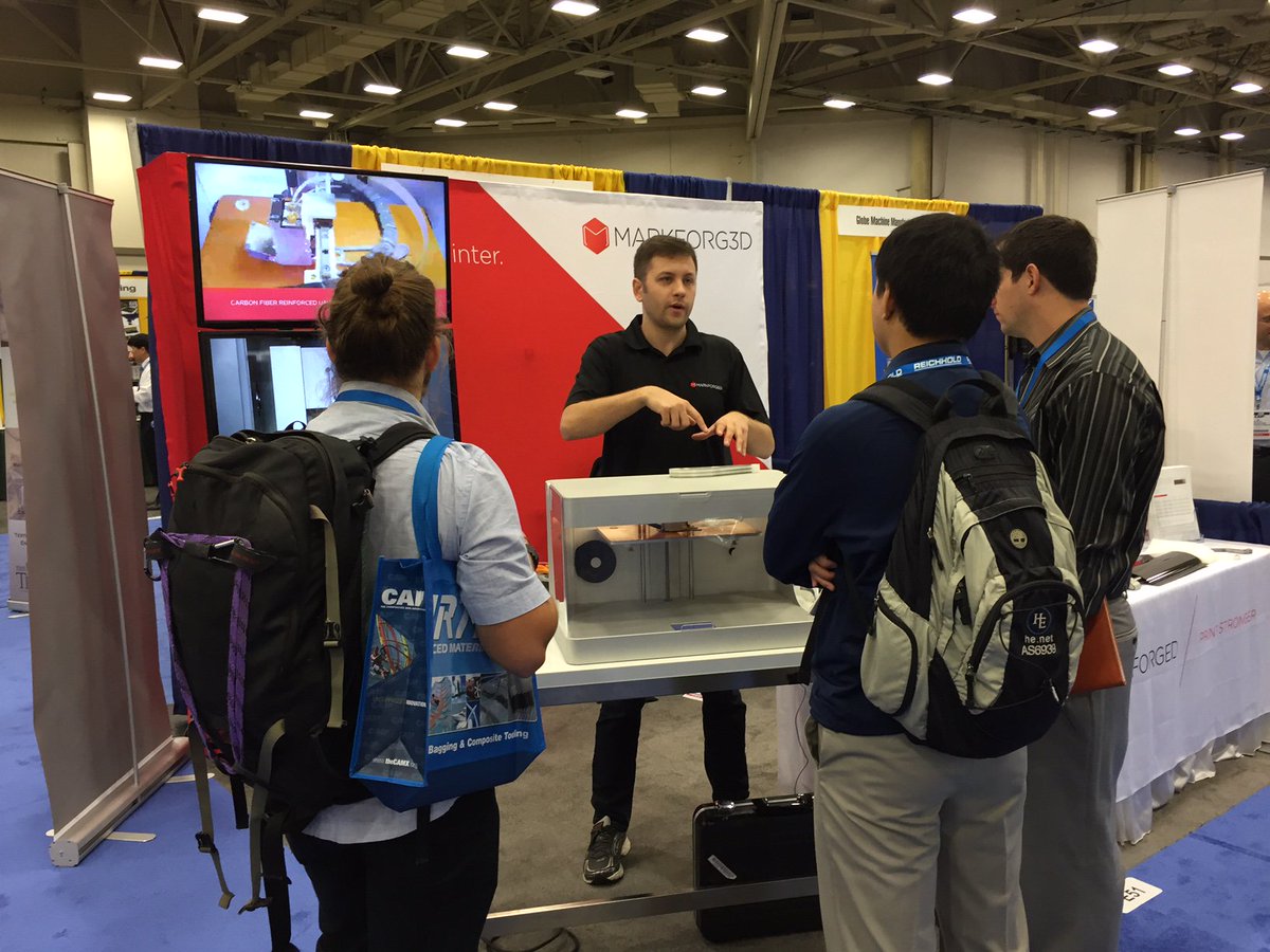 Markforged's tweet photo. MarkForged' own Nick Sondej at #CAMX15. Visit booth e51 to see what carbon fiber part he's pointing at https://t.co/nhZQkl7bGR