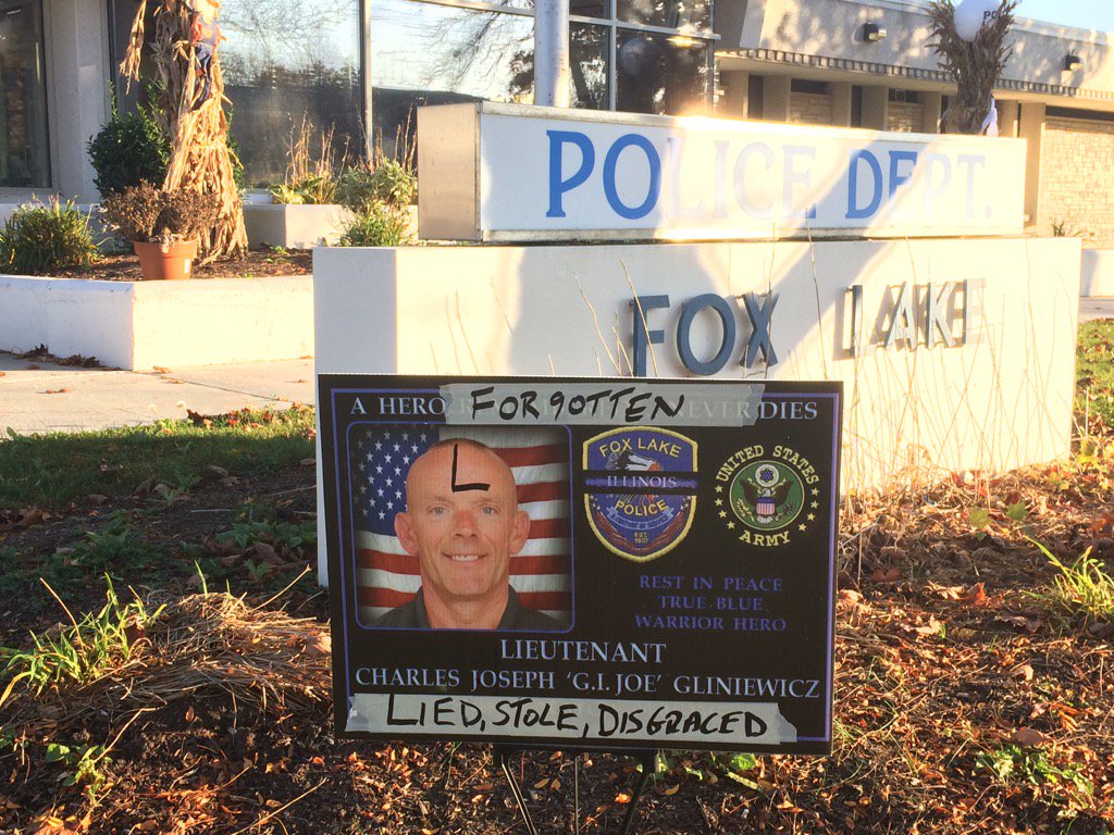 BenBradleyTV's tweet photo. Signs that once honored Lt Joe Gliniewicz now defaced. Live coverage of the suicide &amp; scandal begins on ABC7 at 4pm https://t.co/XLZ9jg1YZN
