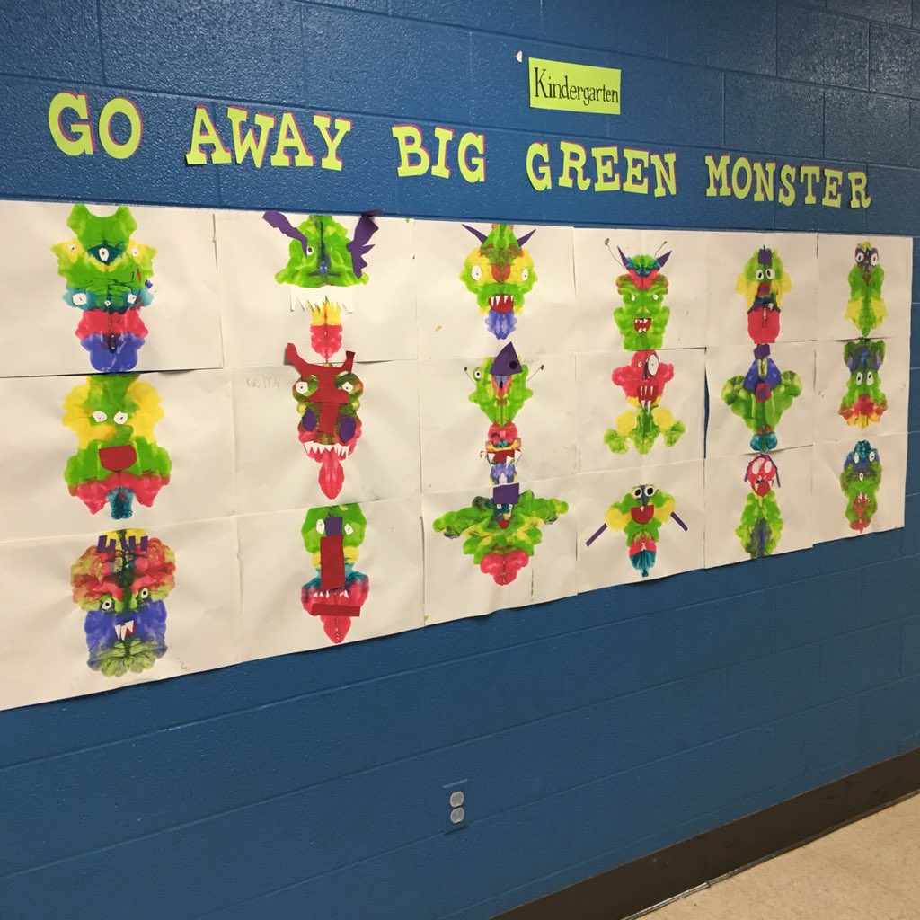 After talking with Kindergarten students about symmetry, they used paint &amp; folded paper to create monster faces.