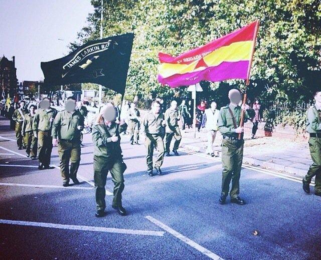 the_Guerrilla's tweet photo. Dave Brown, Irish Republican/AntiFA Activist. Seen here marching with @JLRFB under the Brigadas Internacionales flag https://t.co/o59X5ySrRy