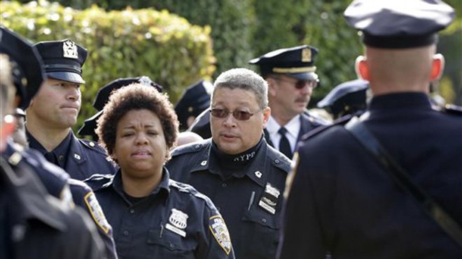 FoxNews's tweet photo. Funeral of slain NYPD officer draws thousands  https://t.co/oZgdAf49fk https://t.co/lenVHAR8JQ