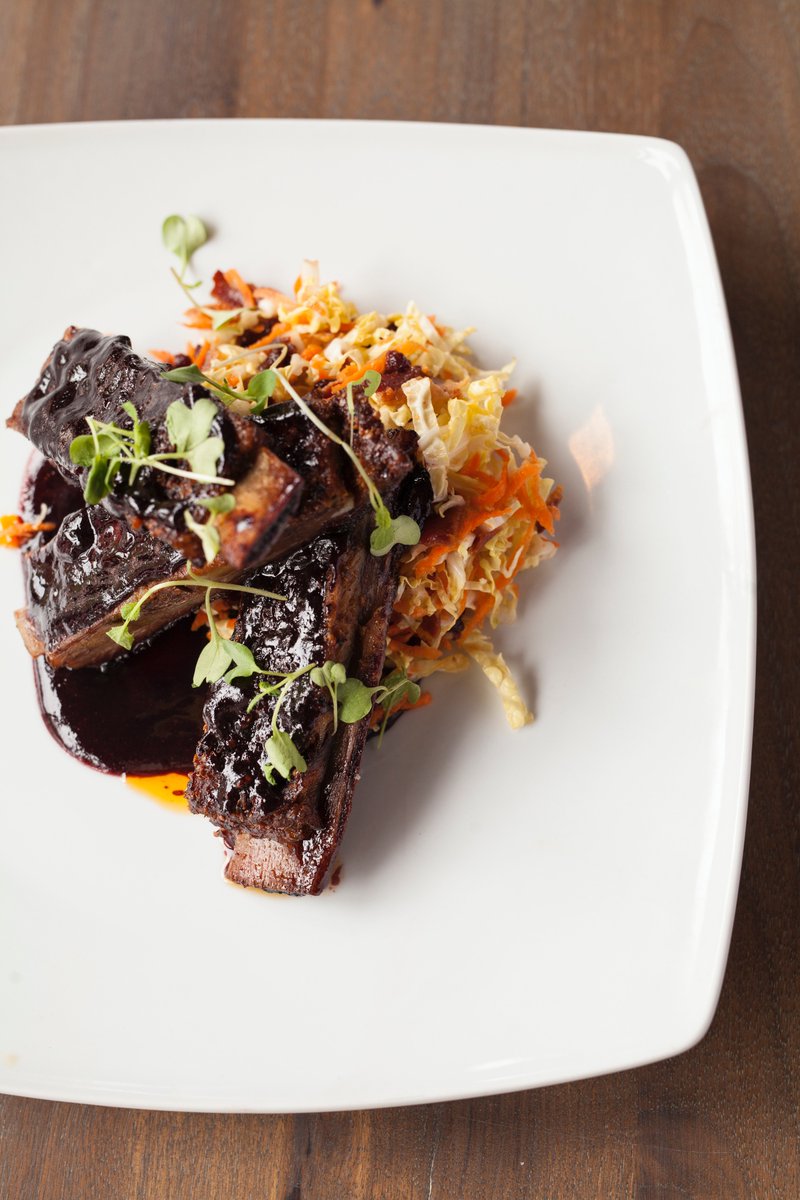 What we're craving (and cooking) for dinner tonight: SLOW ROASTED PORK RIBS, cherry mustard, bacon-cabbage slaw.