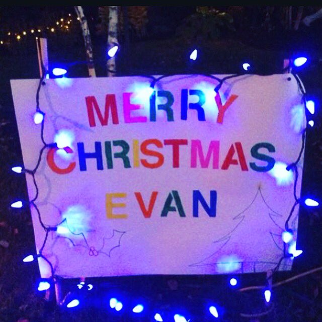 Be sure to wear your red &amp; green AND stop by the atrium during lunch tomorrow to sign the Christmas card for Evan.