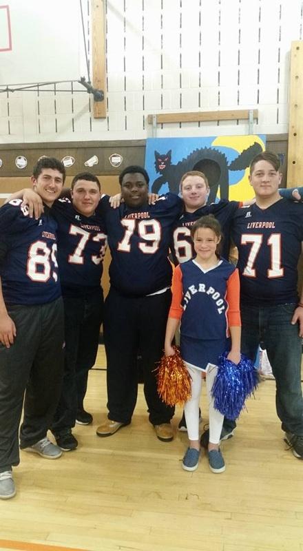 Football players participating at Donlin Drive Elementary Halloween Party.