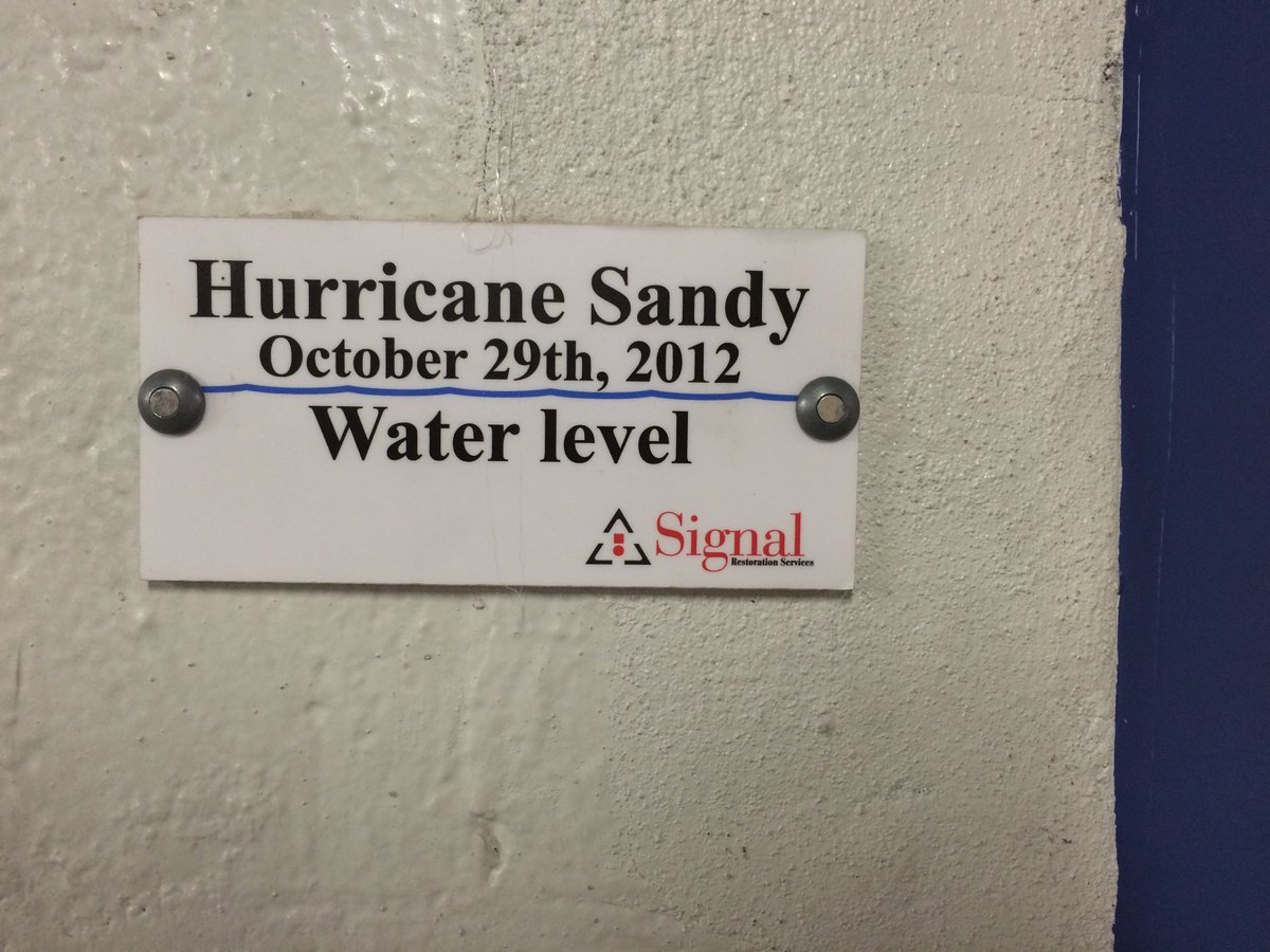 BellevueHosp's tweet photo. 5'3" Lisa shows the line marking where #onthisday in 2012 #Sandy floodwaters rose up to 14' in our basement. https://t.co/7IhYpjwo2L