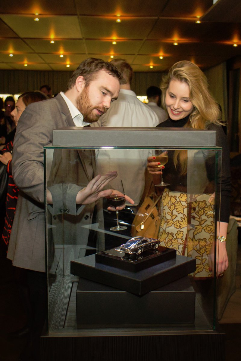 grantmacdonaldS's tweet photo. Our talented designer Luke explaining the craft behind our #AstonMartin DB5 at our #Timeless100 event #AMArtofliving https://t.co/hPSGbaHBAe