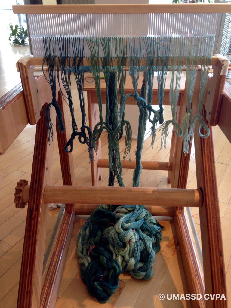 umassdcvpa's tweet photo. Threading the looms #umassdartmouth #umassdcvpa  #sofa22 #sofaexpo #sofachicago #weavingwithlight https://t.co/irfUHowo3s