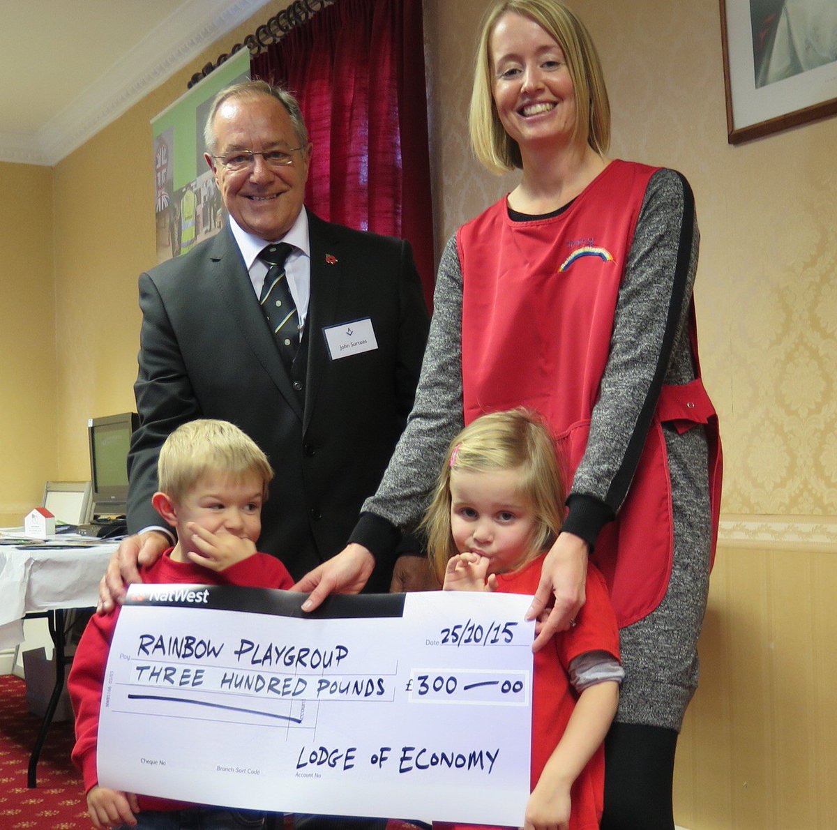 Great Open Day at Winchester Masonic Centre. Rainbow Playgroup receiving L of Economy donation for New Forest Trip