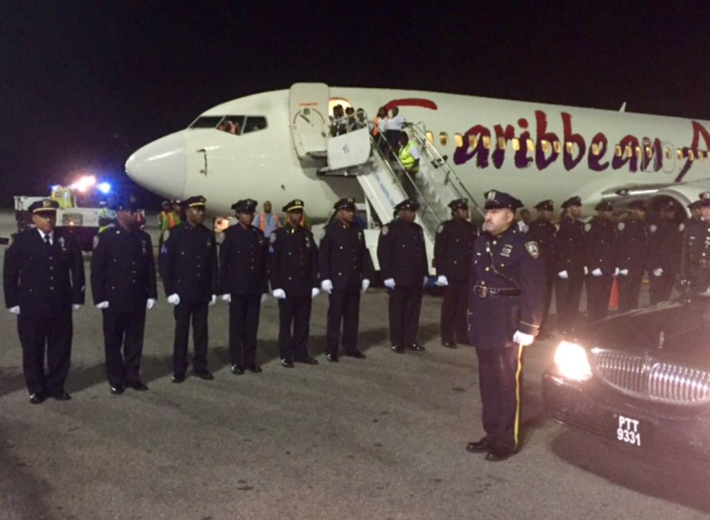 CommissBratton's tweet photo. Members of NYPD &amp; Guyana Police honor Detective Holder &amp; his family as he is laid to rest in Guyana. #NeverForget https://t.co/SgToexCaG0