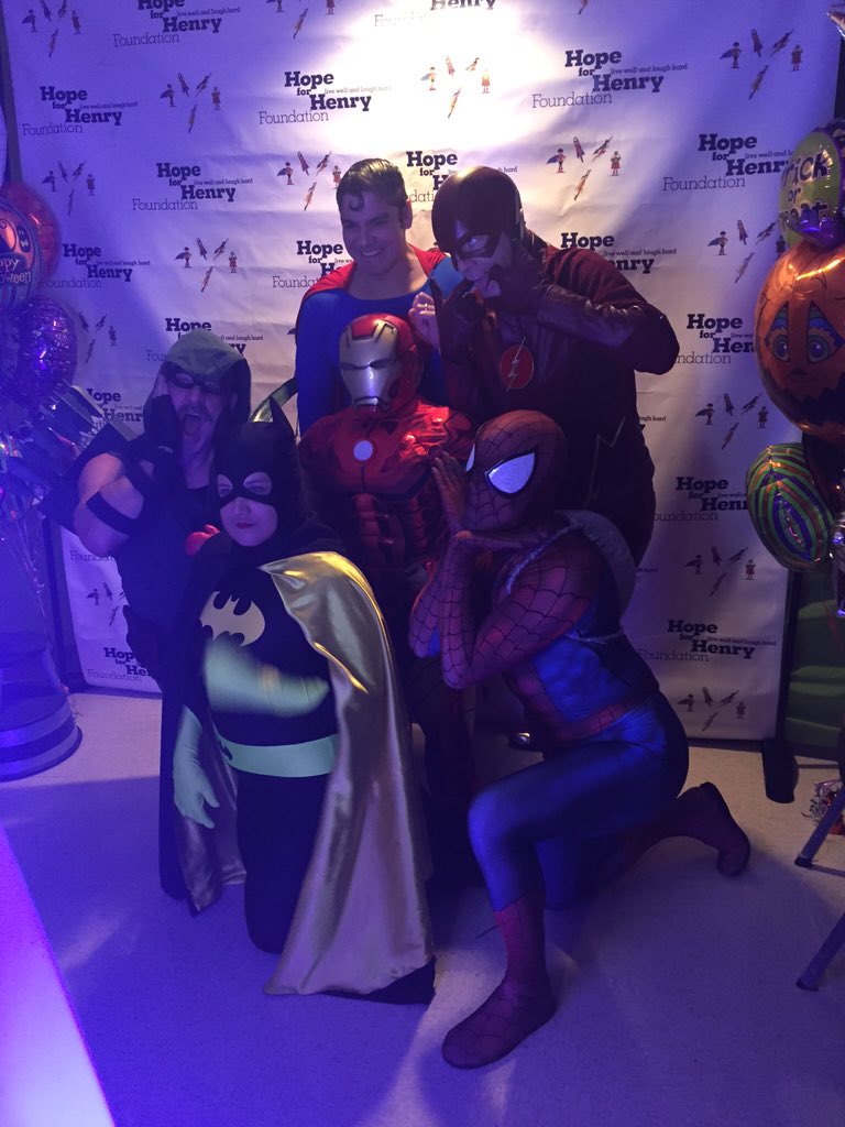 Taking photo booth pictures with the super heroes at the Halloween party at Medstar Georgetown University Hospital!
