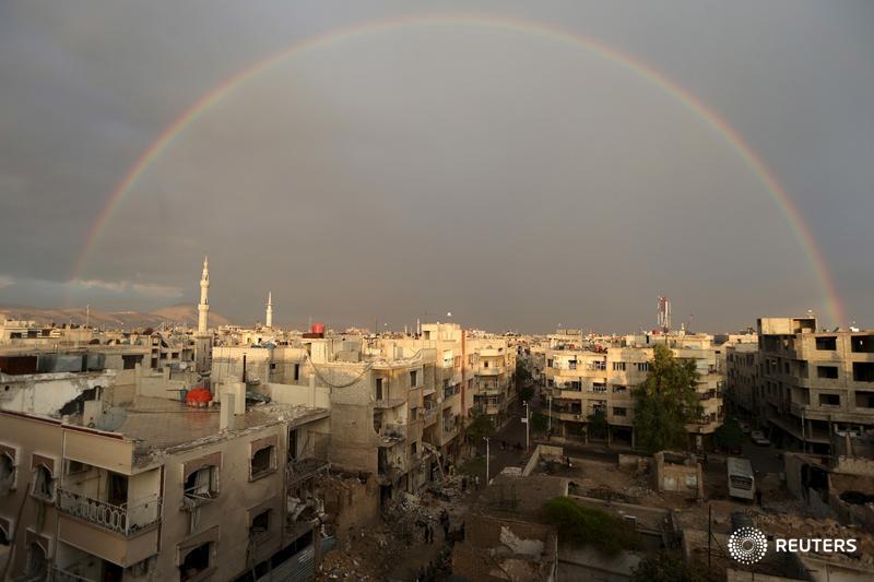 Reuters's tweet photo. A rainbow in Syria, and more scenes from around the world. Editor's Choice: https://t.co/ysiuZGUUbE https://t.co/32ipmhKpnu
