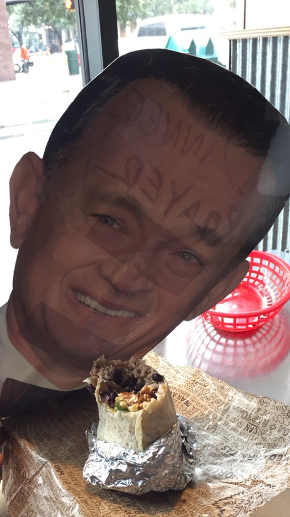TannerKalina's tweet photo. T money, @tomhanks , is stealing my burrito before #dinnerprayer steals the show at #AustinFilmFest https://t.co/ZPmAzUwiqs