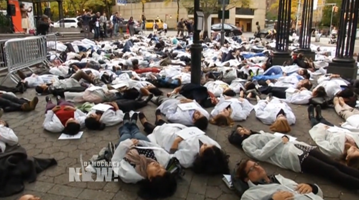 democracynow's tweet photo. Doctors Stage Die-In to Protest Killing of Syrian Healthcare Workers https://t.co/iPYudn45NF https://t.co/zIZArpWmLd
